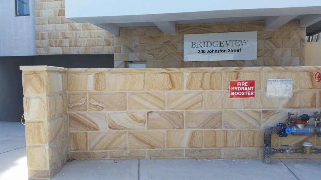 Sandstone front wall at an apartment entrance
