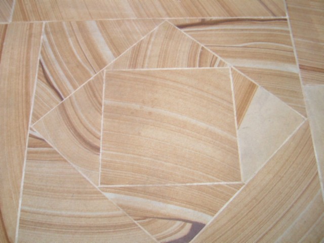 Sandstone tiles laid in a geometric pattern