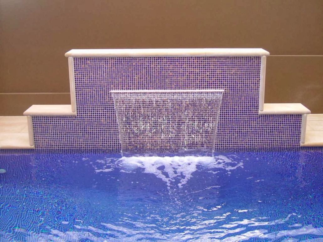 Pool water feature set in tiled stone
